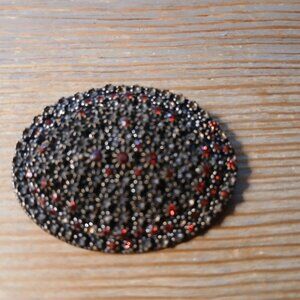 Vintage silver oval brooch with red stones